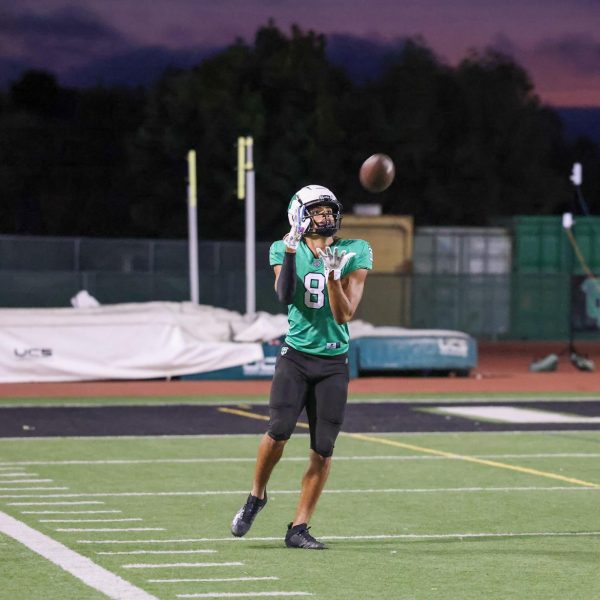 START THE FIREWORKS - Two minutes before halftime, junior wide receiver Hayden Vercher catches a ball down the sideline to shorten the lead during the Thousand Oaks High School Homecoming game on Sept. 20. The Lancers were routed by the Simi Valley Pioneers with a score of 42-28. (Alan Ko/The Lancer)