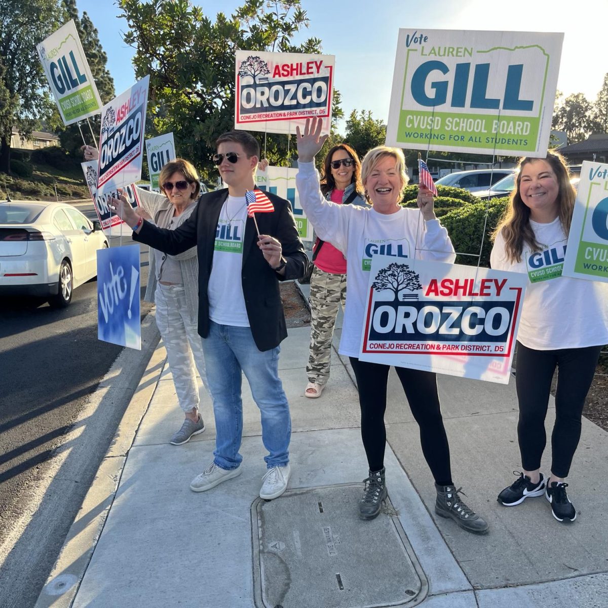 HONK FOR DEMOCRACY - Junior Finn Kerns stands with CVUSD Board Trustee Lauren Gill and her supporters to bring attention to local elections.