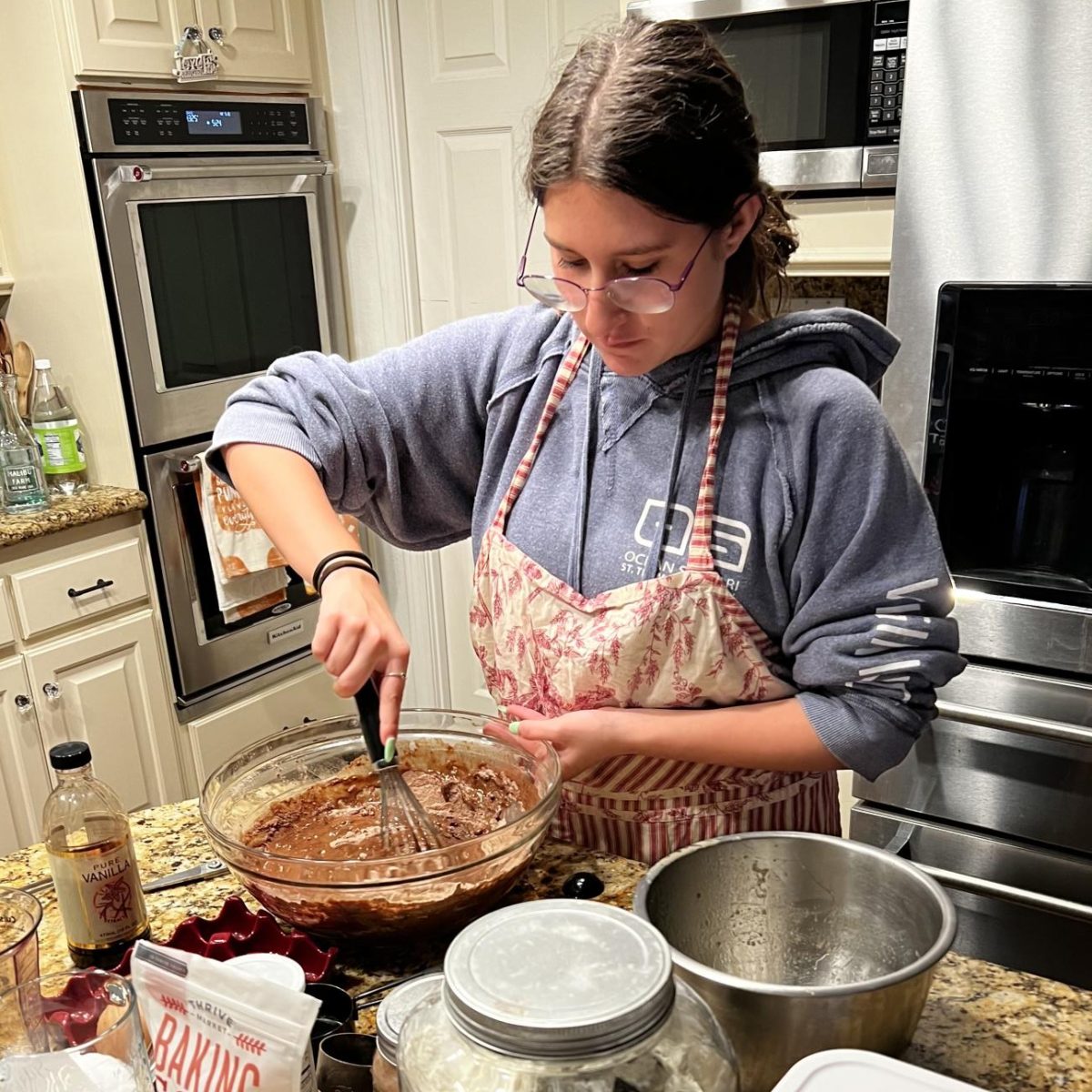 IT’S ALL ABOUT THE PREP - Madison Cuellar mixes ingredients thoroughly into her batter for a fresh loaf of bread, while ensuring every measurement of the recipe is correct and properly used. 