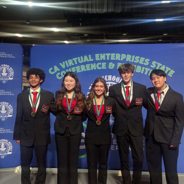 NEW YORK CITY BOUND - ETHOS seniors Peter Escovedo, Samantha Horiuchi, Alyssa Kiszczak, Jonathan Ostergren and Presley Diep pose at the awards ceremony after getting their eighth place medals. (Kellie Chiapuzio - with permission)