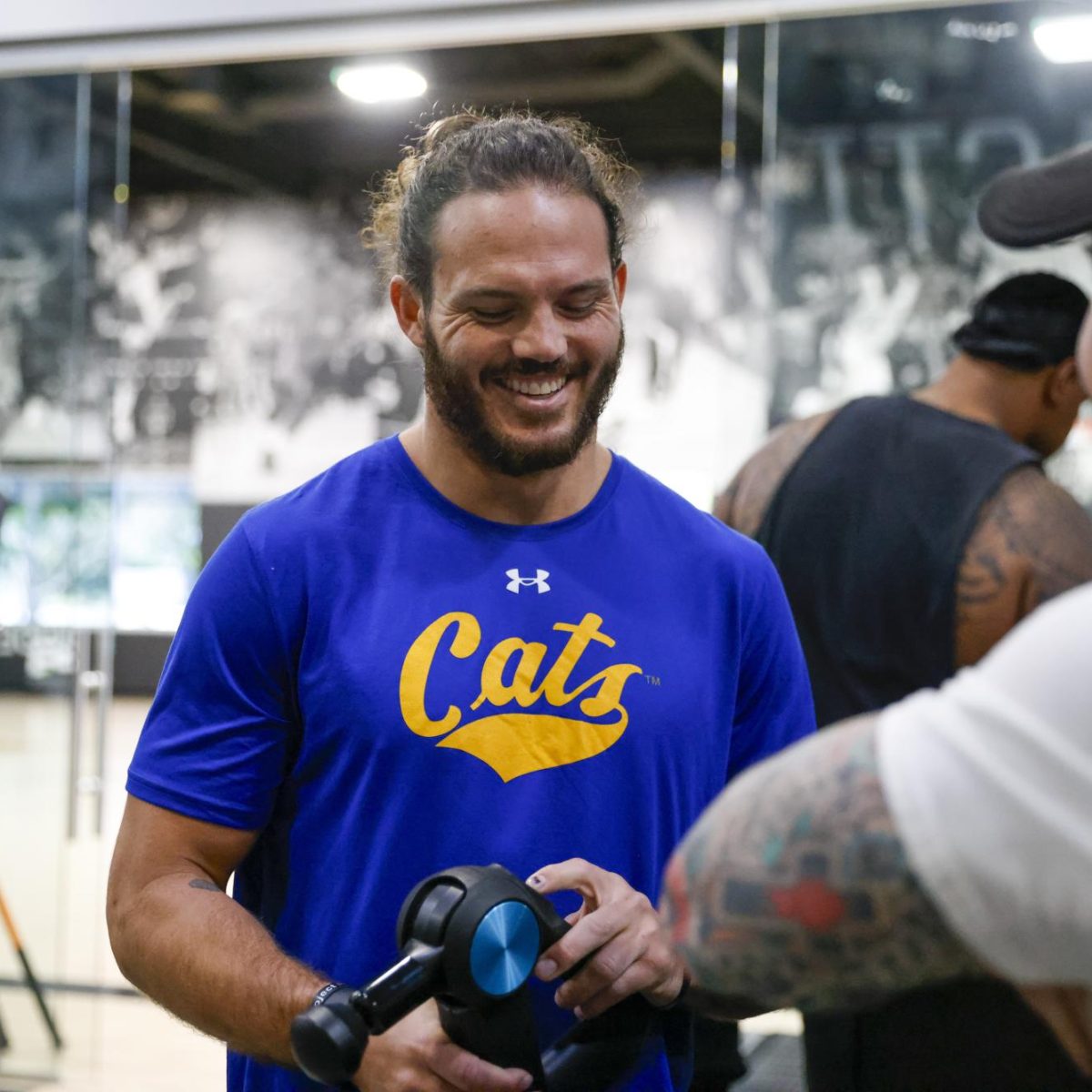 LIFTING UP - Denver Broncos LB Alex Singleton shares a laugh while getting his work in.